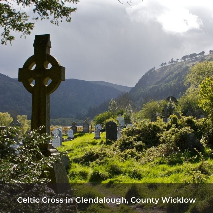 Celtic stone cross in a cemetery in a valley