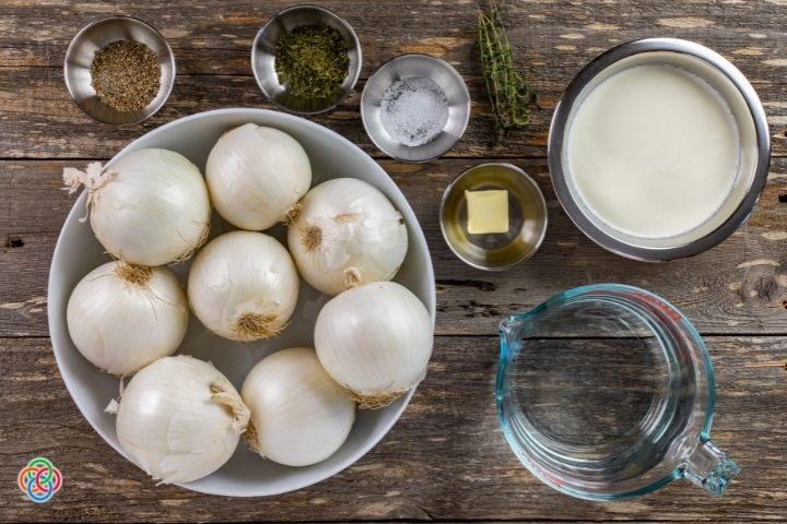 Ingredients for creamy baked onions Irish style | Irish American Mom Onions in a bowl with bowls of pepper, parsley, salt, butter cream and water