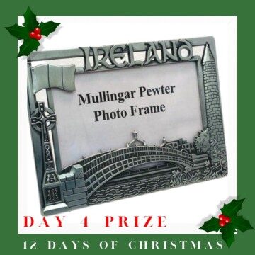 Metal photo frame with holly sprigs and text overlay