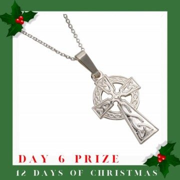 Silver cross pendant with holly sprigs and text