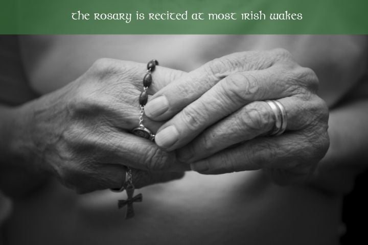 the rosary is recited at most Irish wakes | Irish American Mom Old hands holding a roasary beneath a text banner