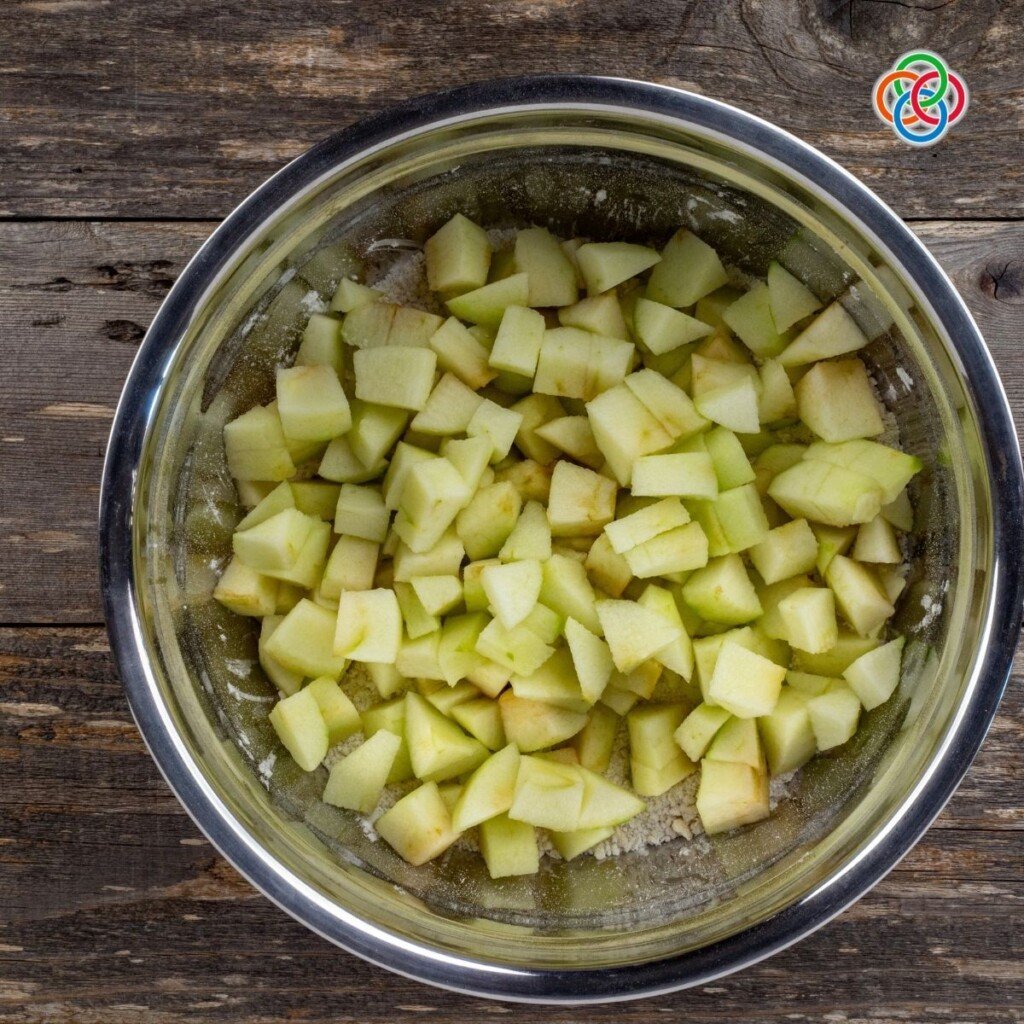 Slicing apples for Kerry Apple Cake Apple pieces in a bowl
