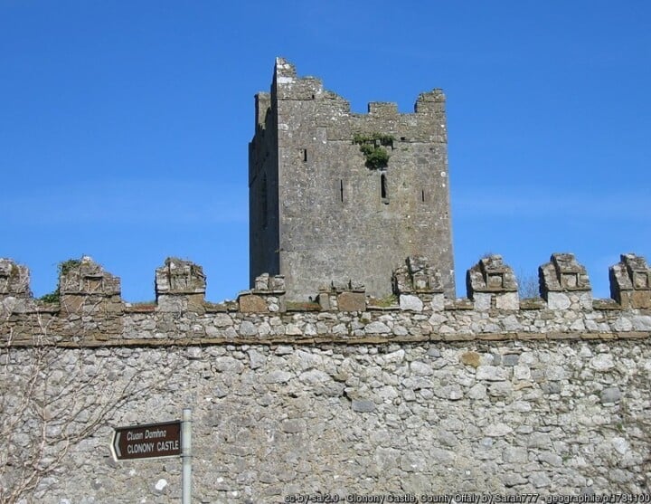 Stone castle behind a stone wall