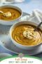 Two bowls of lentil soup with spoons
