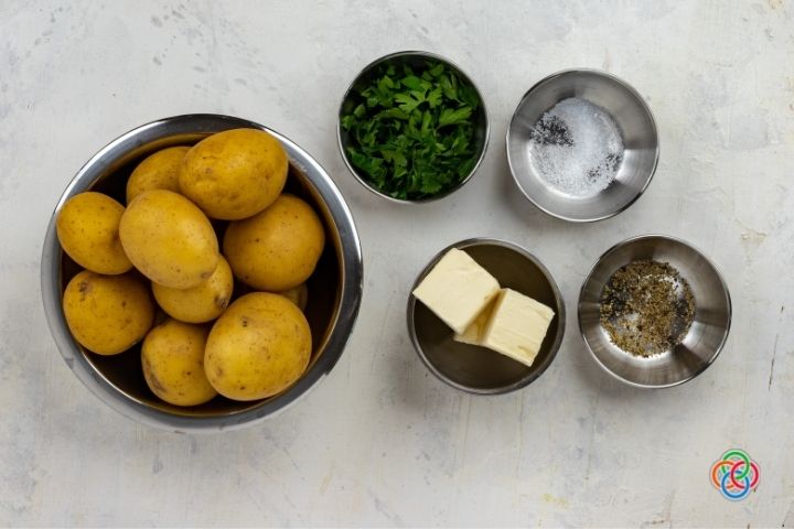 Ingredients for buttered parsley potatoes | Irish American Mom Bowls of potatoes, butter, parsley, salt and pepper