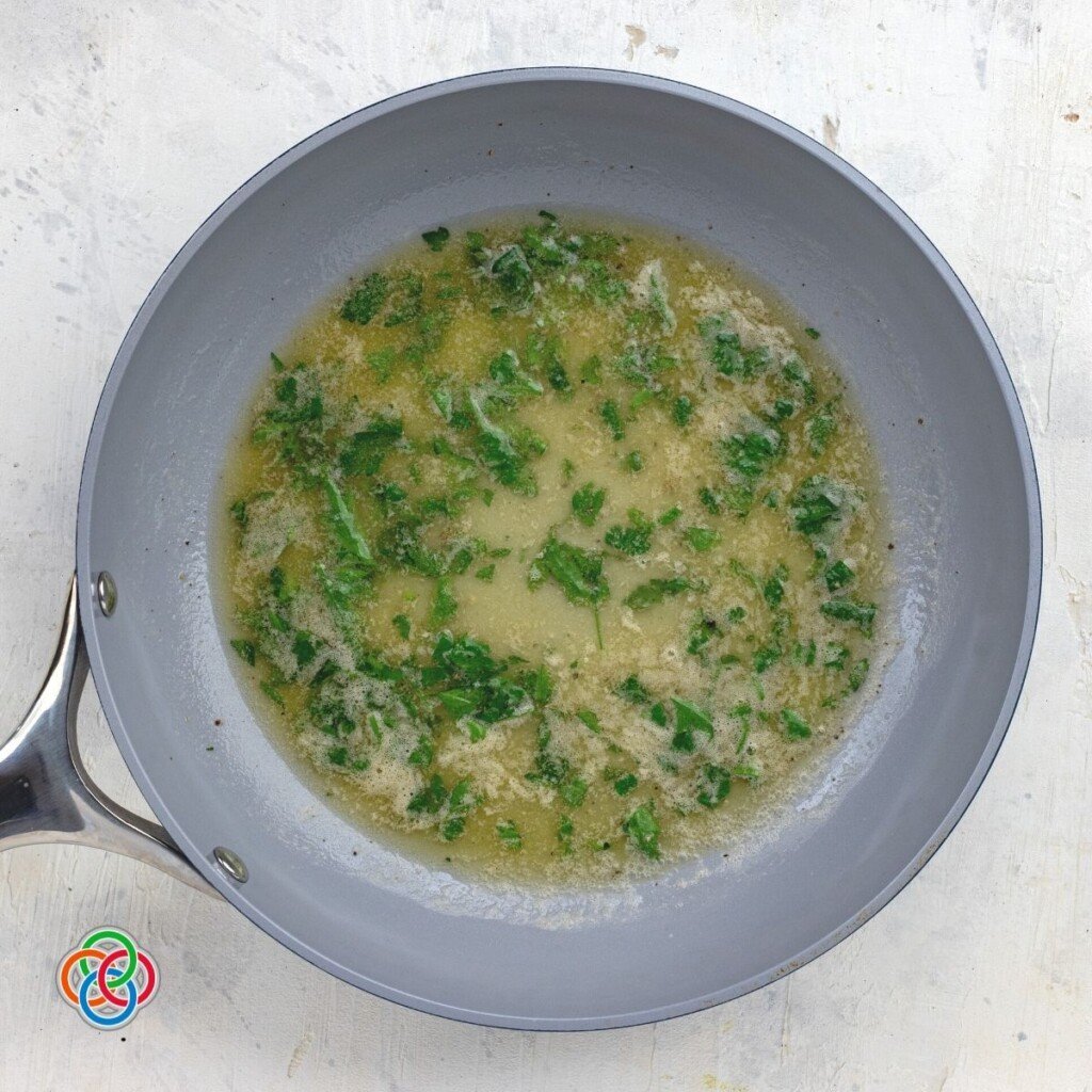 Parsley butter for tossing potatoes | Irish American Mom Parsley butter in a skillet