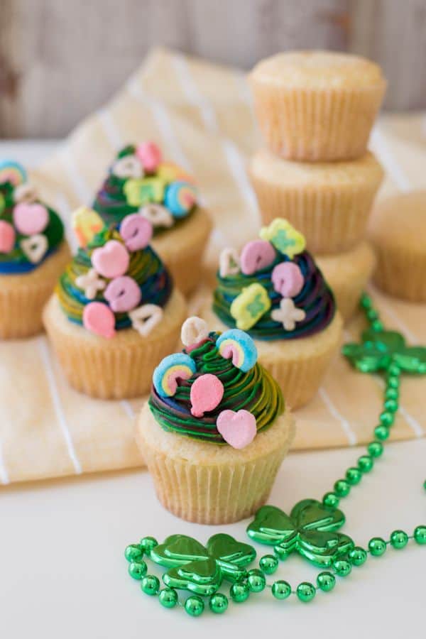 Lucky Charms Cupcakes for Celebrating Saint Pattys Day | Irish American Mom Cup cakes topped with lucky charms