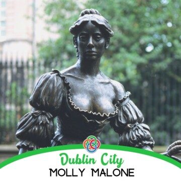 Bronze statue of woman with text banner
