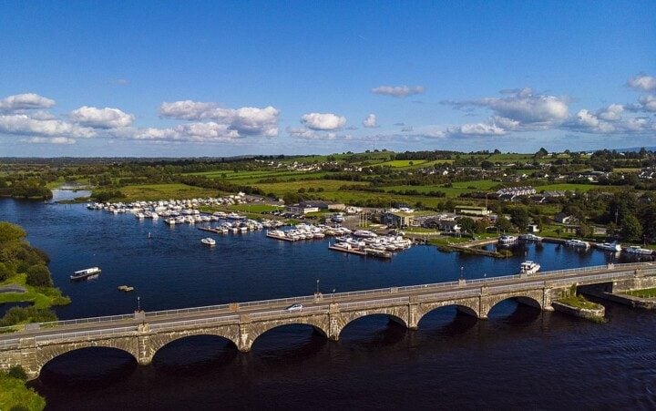 Bridge over a river with a boat marina