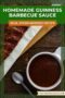 A bowl of dark, rich Guinness barbecue sauce with a spoon beside it and grilled ribs in the background, with text overlay reading “Homemade Guinness Barbecue Sauce – Rich, Stout-Infused Recipe.”