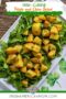 Plate of Irish potato and chive salad with roasted potatoes, fresh greens, and chopped chives, labeled Irish Cuisine Potato and Chive Salad with Irish American Mom branding.