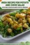 Plate of potato and chive salad on a bed of greens with a text banner above and decorative shamrocks.