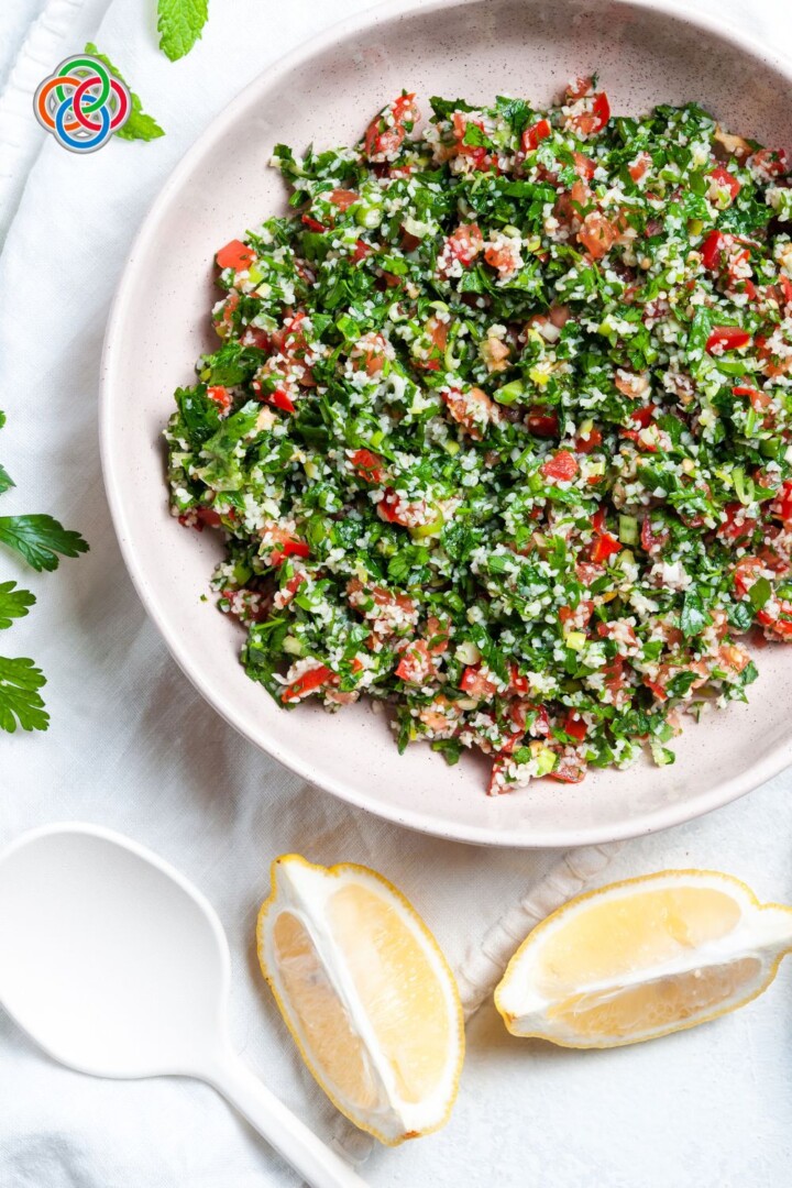 Tabbouleh Salad with lemon wedges | Irish American Mom Bowl of tabbouleh with lemon wedges