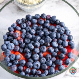 Layer of blueberries in a glass bowl