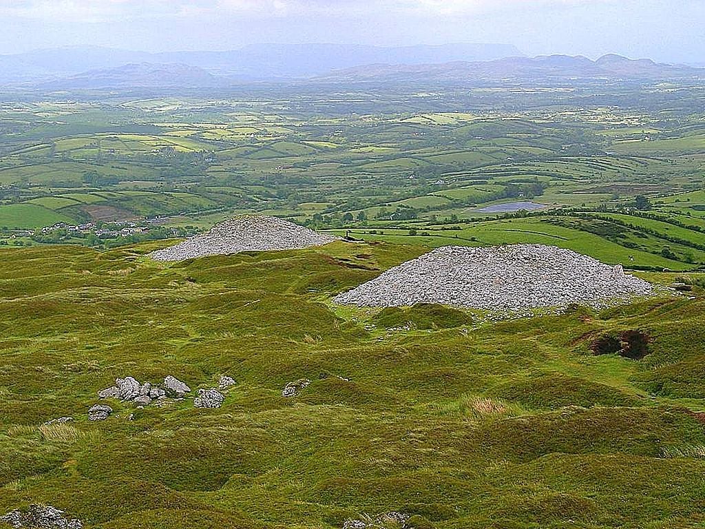 Aerial view of two stone mounds on a mountain