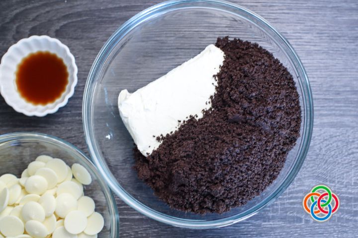Ingredients for patriotic truffles | Irish American Mom Bowl of cookie crumbles, cream cheese, vanilla extract and white chocolate chips
