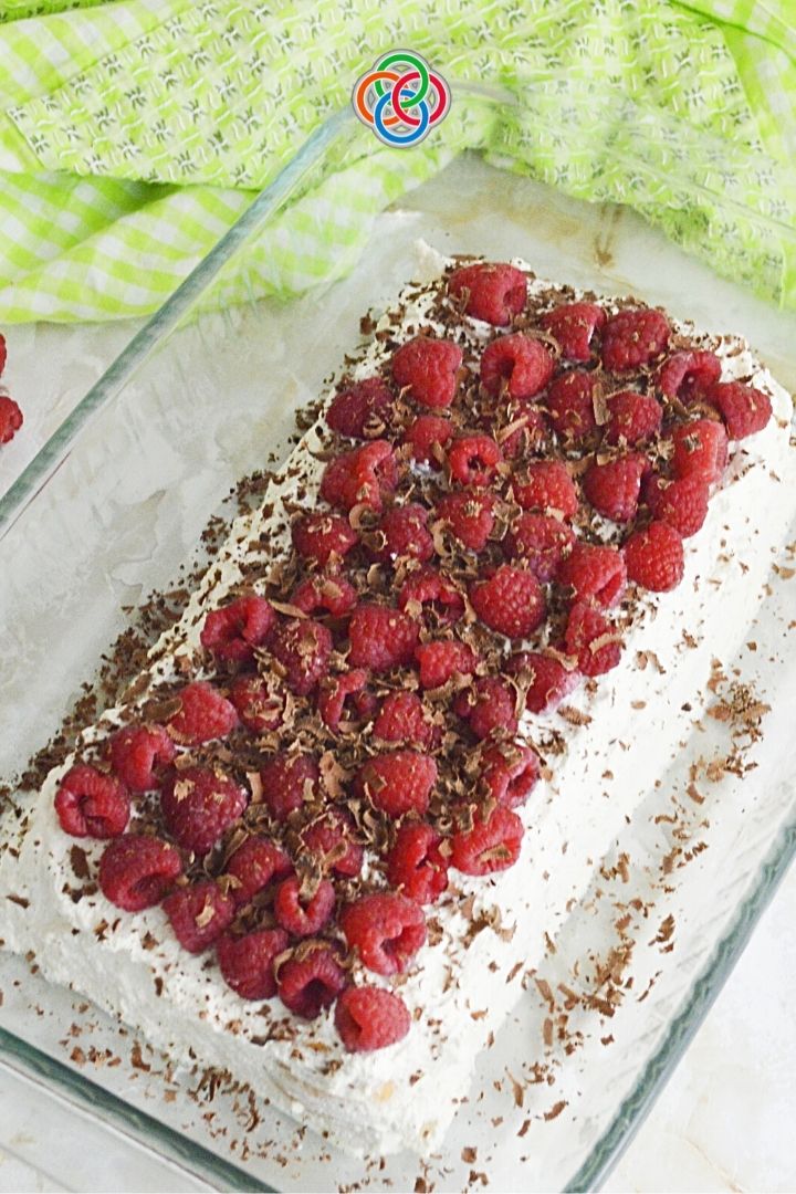 Raspberry and vanilla ice box cake with chocolate shavings for decoration | Irish American Mom Raspberry icebox cake in a casserole dish