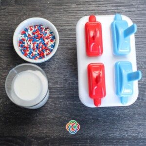 Popsicle molds with cake sprinkles and coconut milk