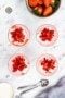 Four desserts with chopped strawberries