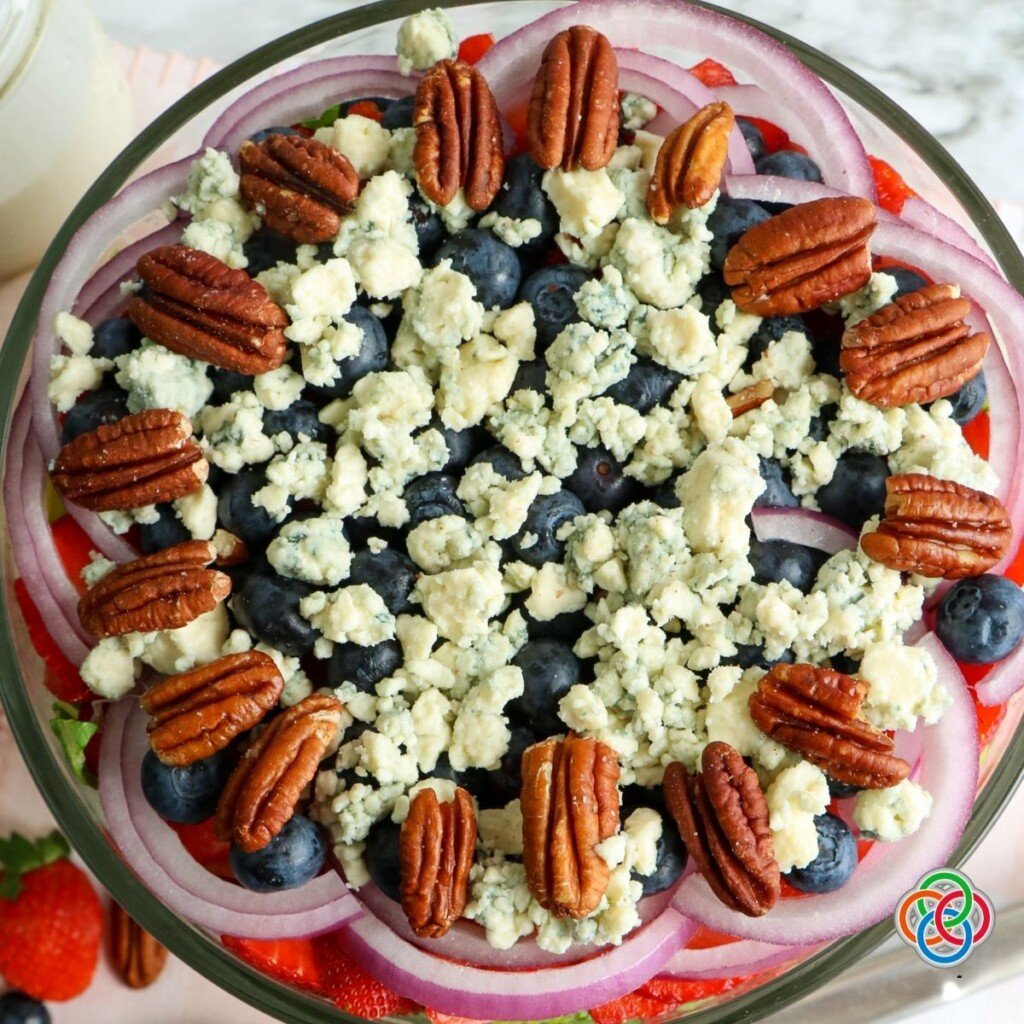 Topping a salad with blue cheese and pecans | Irish American Mom Pecans and blue cheese topping for a salad