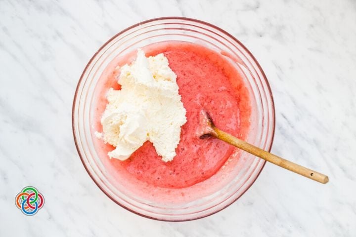 Whipped Cream and strawberry mixture in a bowl | Irish American Mom Cream in a strawberry mousse mixture in a bowl