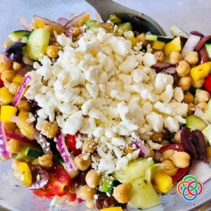Feta cheese over a veggie salad