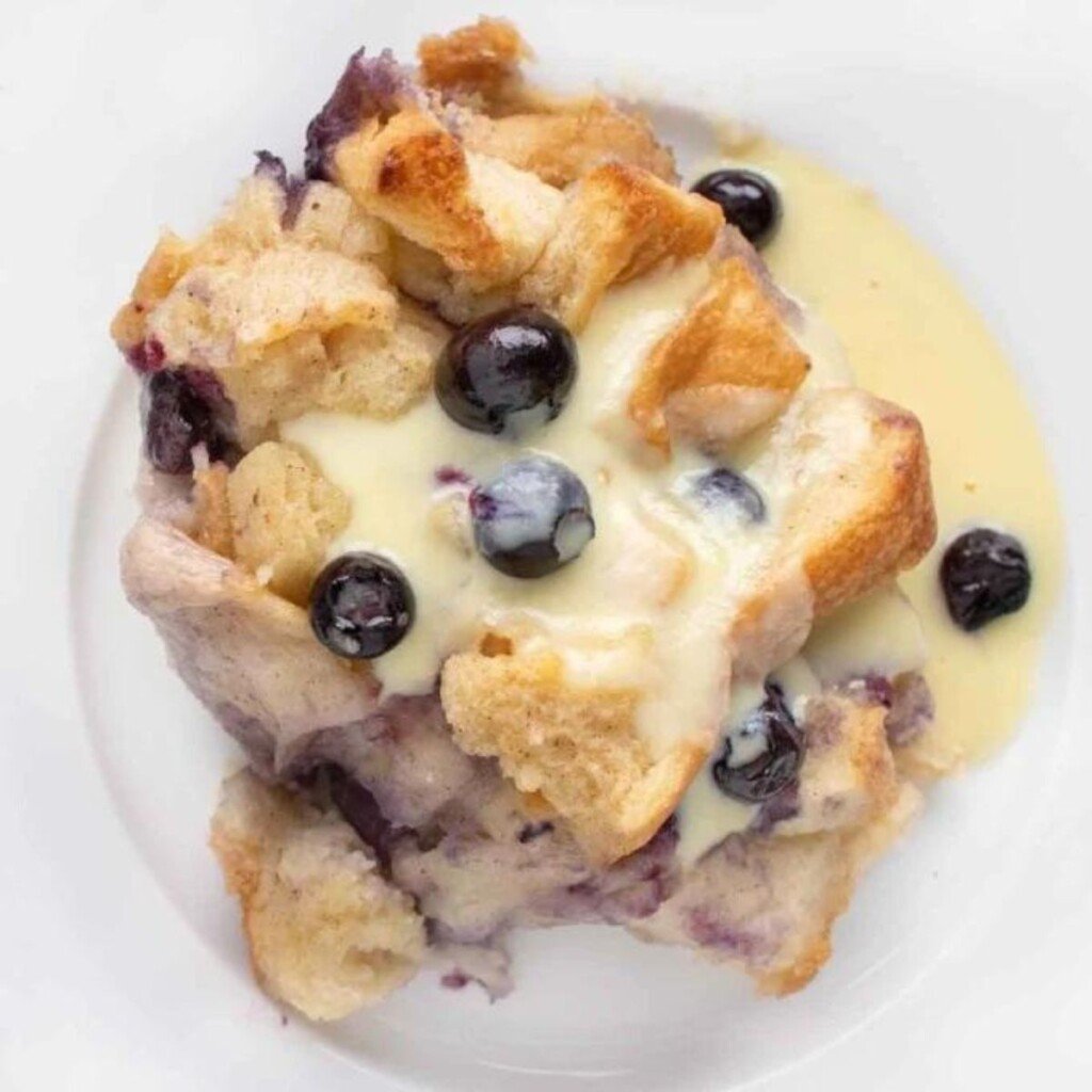 Blueberry bread pudding serving with custard sauce