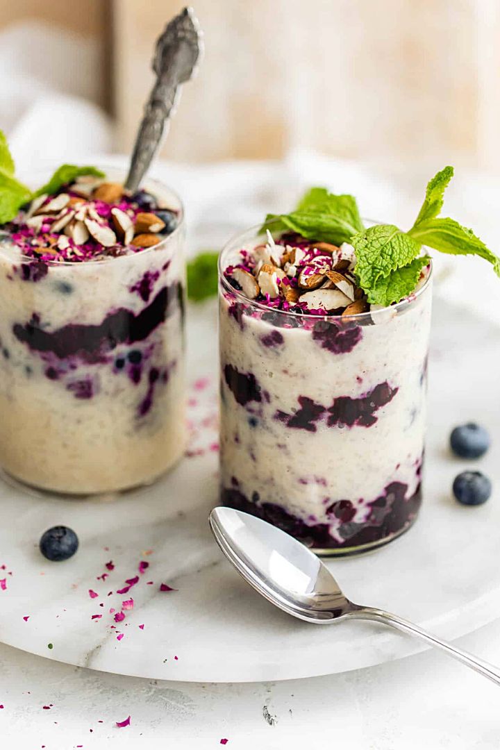 Two glasses of rice pudding with jam layer