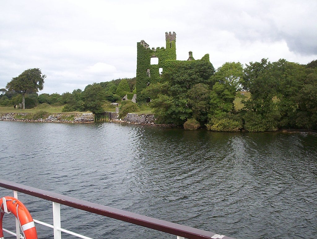 Looking at Menlo Castle from the River Corrib Cruise | Irish American Mom Castle beside a river seen from a boat