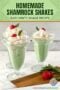 Three homemade shamrock shakes topped with whipped cream, cherries, and mint leaves in glass dessert cups on a white table and a text banner.