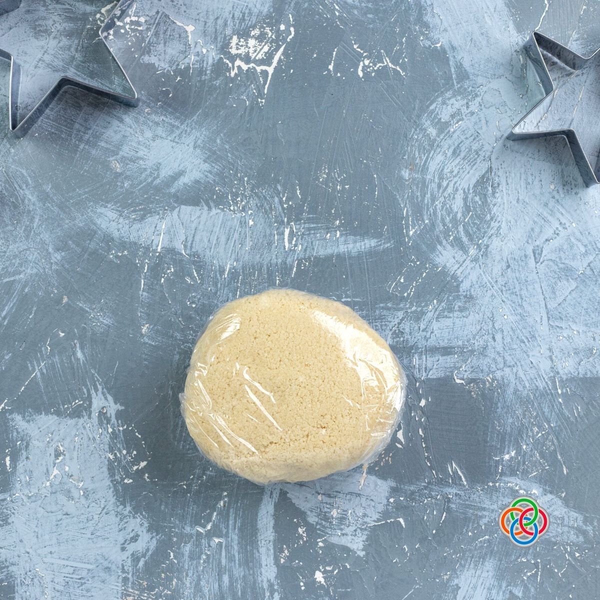Dough ball wrapped in plastic wrap for chilling for star cookies | Irish American Mom Cookie dough wrapped in plastic wrap