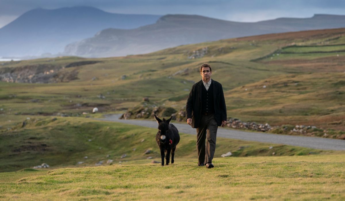 The Banshees of Inisherin | Irish American Mom Man walking with a donkey in a field