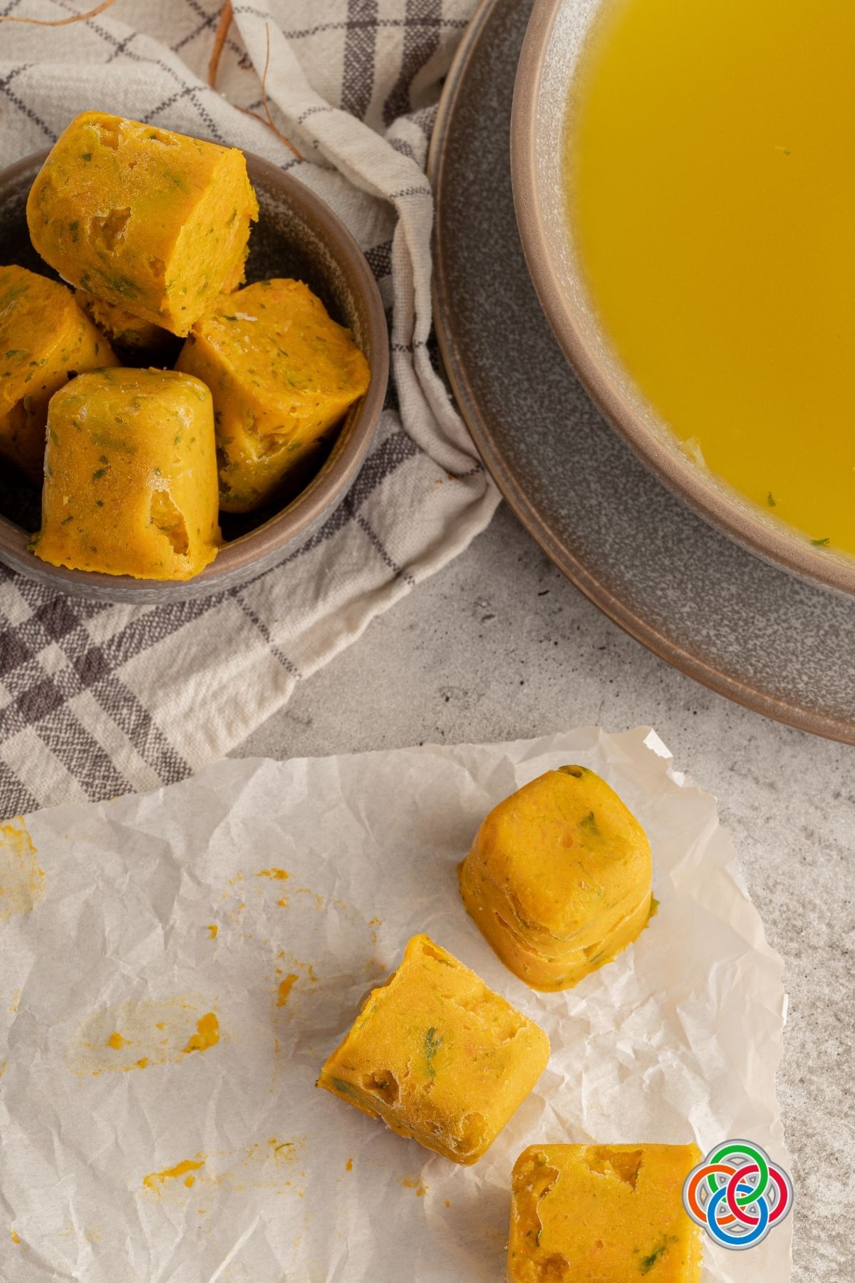 Homemade vegan vegetable stock cubes with added water | Irish American Mom Stock cubes beside a bowl of stock