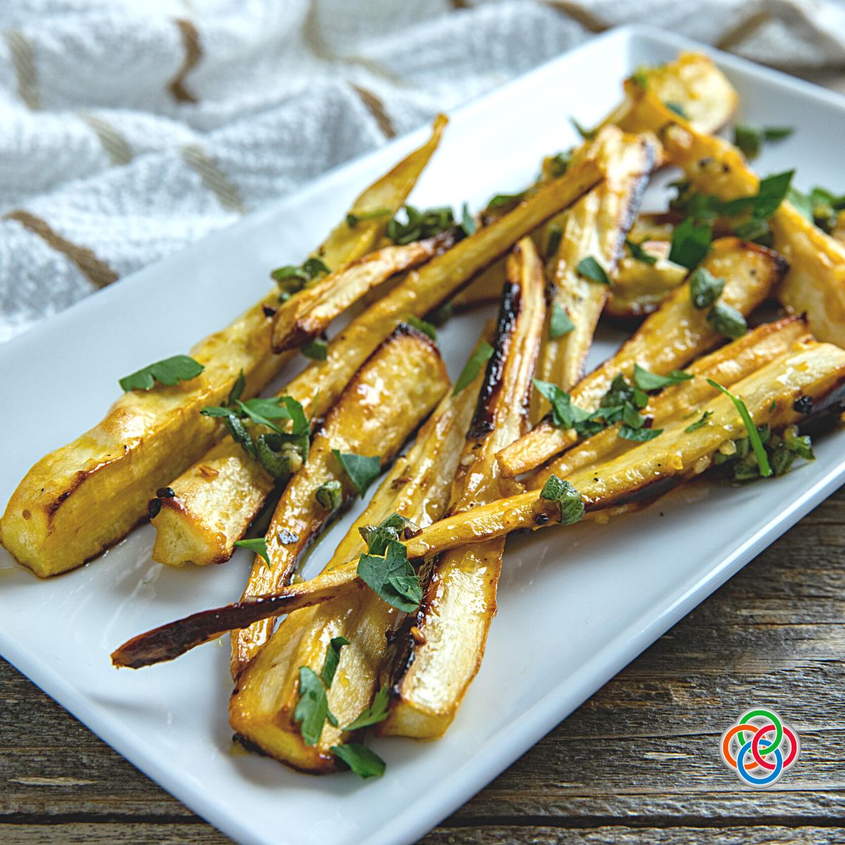 Honey oven roasted sliced parsnips | Irish American Mom Plate of roasted sliced parsnips