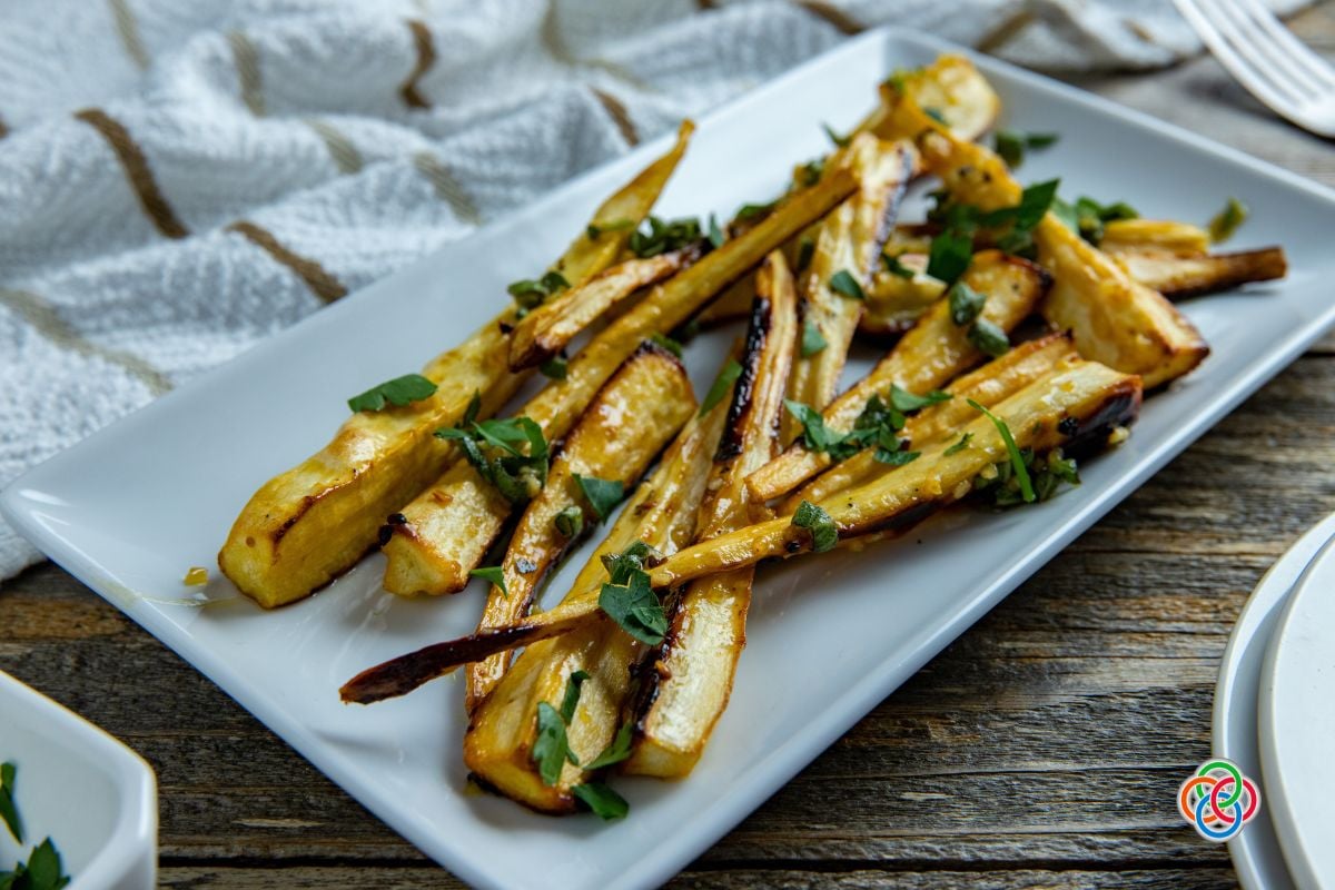 Oven roasted parsnips with honey | Irish American Mom Slices of roasted parsnips on a platter
