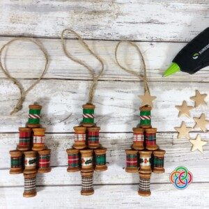 Wooden spool Christmas trees with glue gun and stars