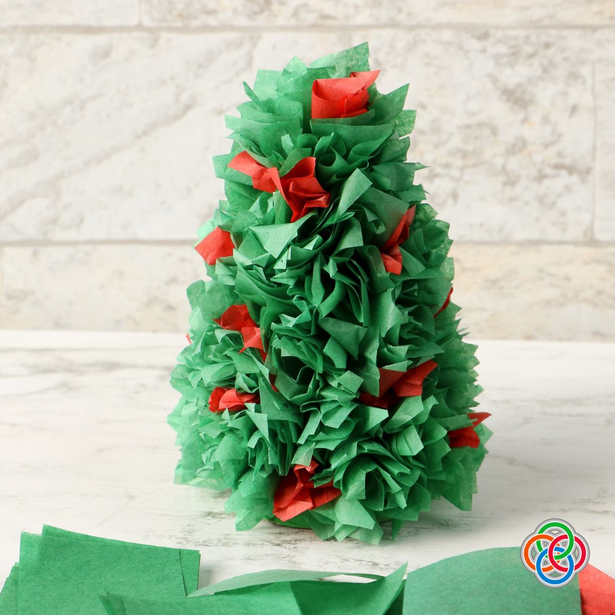 Creating a tissue paper and cardboard cone decorative Christmas tree | Irish American Mom Tissue paper Christmas tree