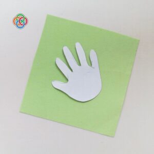 Handprint cutout on green paper