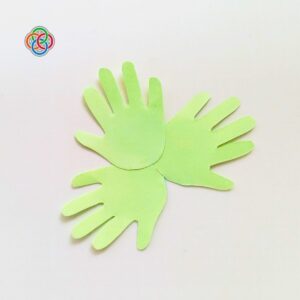 Three handprint cutouts forming a shamrock shape