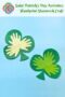 Paper shamrocks and text banner