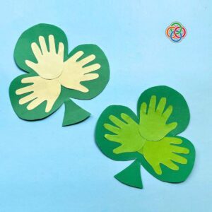 Paper shamrocks with handprint motifs