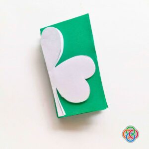Shamrock template on folded green paper