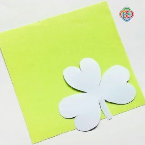 Paper shamrock cutout with logo