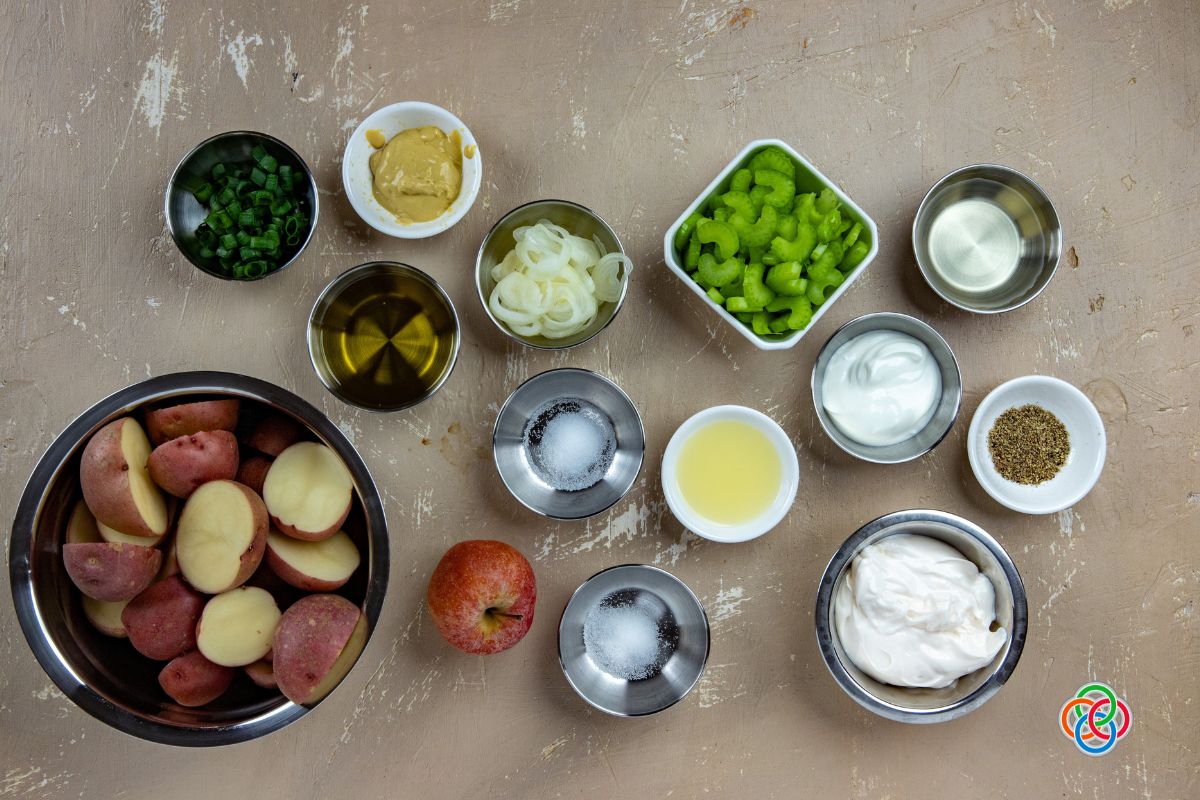 Ingredients for apple celery potato salad | Irish American Mom Bowls of ingredients for making apple celery potato salad.