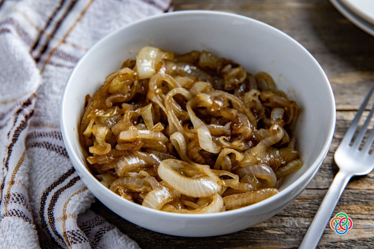 Bowl of sauteed onions with logo
