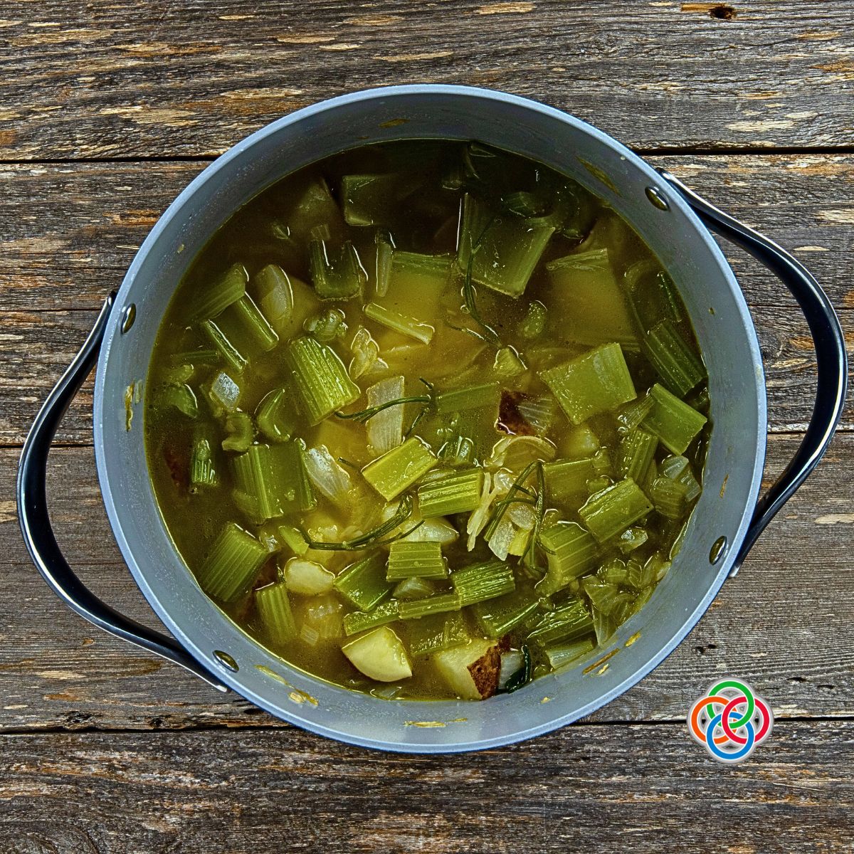 Adding stock for Irish Parsley Soup | Irish American Mom Soup cooking in a pot