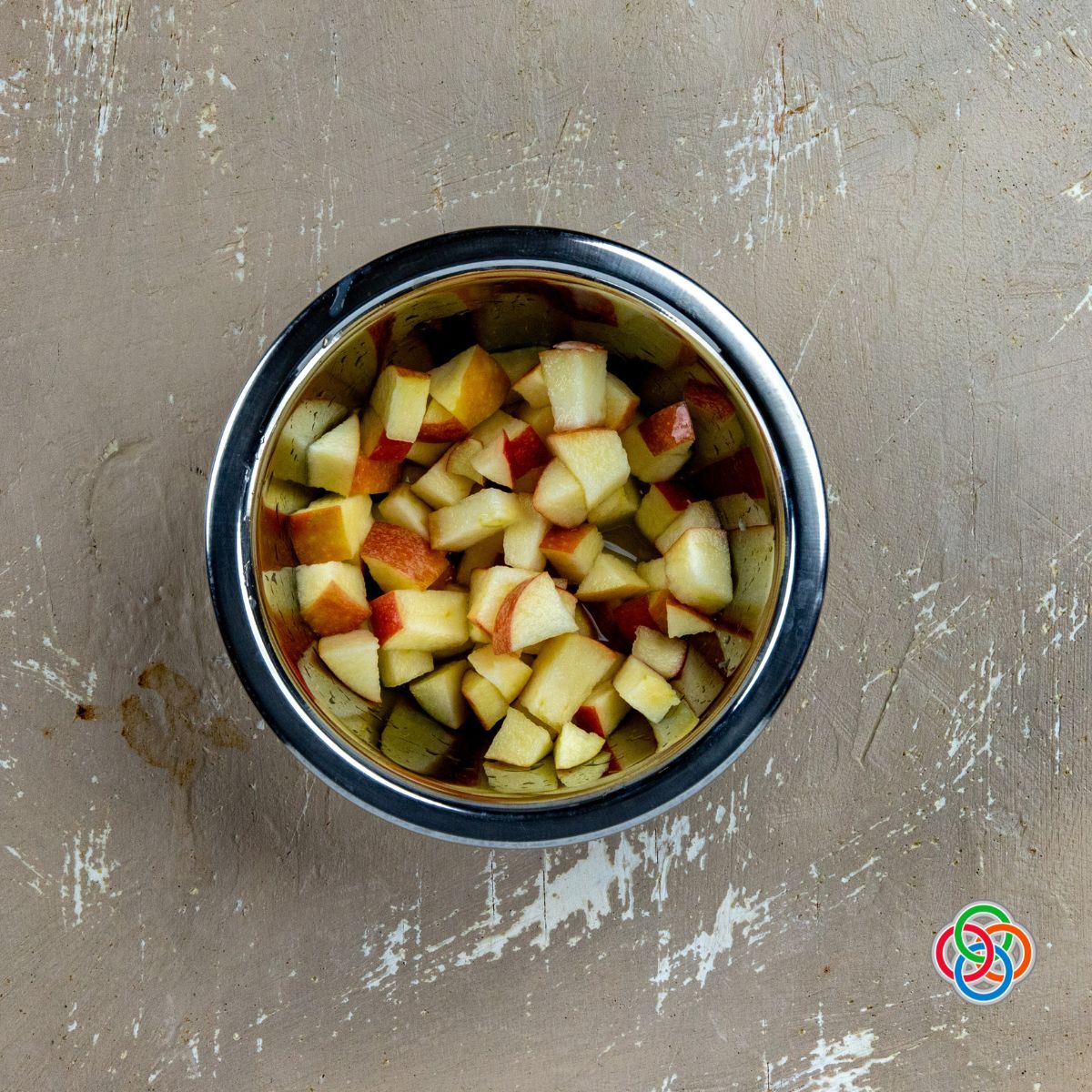 Lemon juice mixed with diced apples for potato salad recipe | Irish American Mom Chopped apples in a bowl