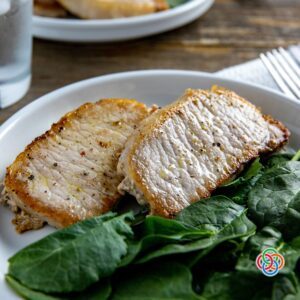 Fried pork chops with spinach