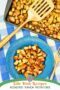 Plate of diced roasted potatoes and a sheetpan of roasted potatoes with a golden spatula