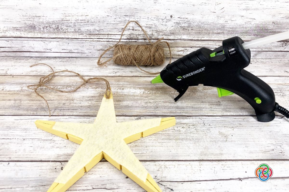 Adding hanging string to a star ornament with a glue gun